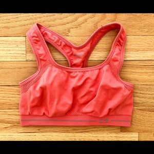 Champion sports bra in coral orange color, size S